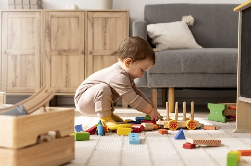 full-shot-child-playing-with-colorful-toys