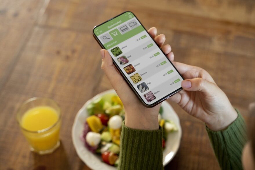 woman-buying-fruits-online-using-her-smartphone